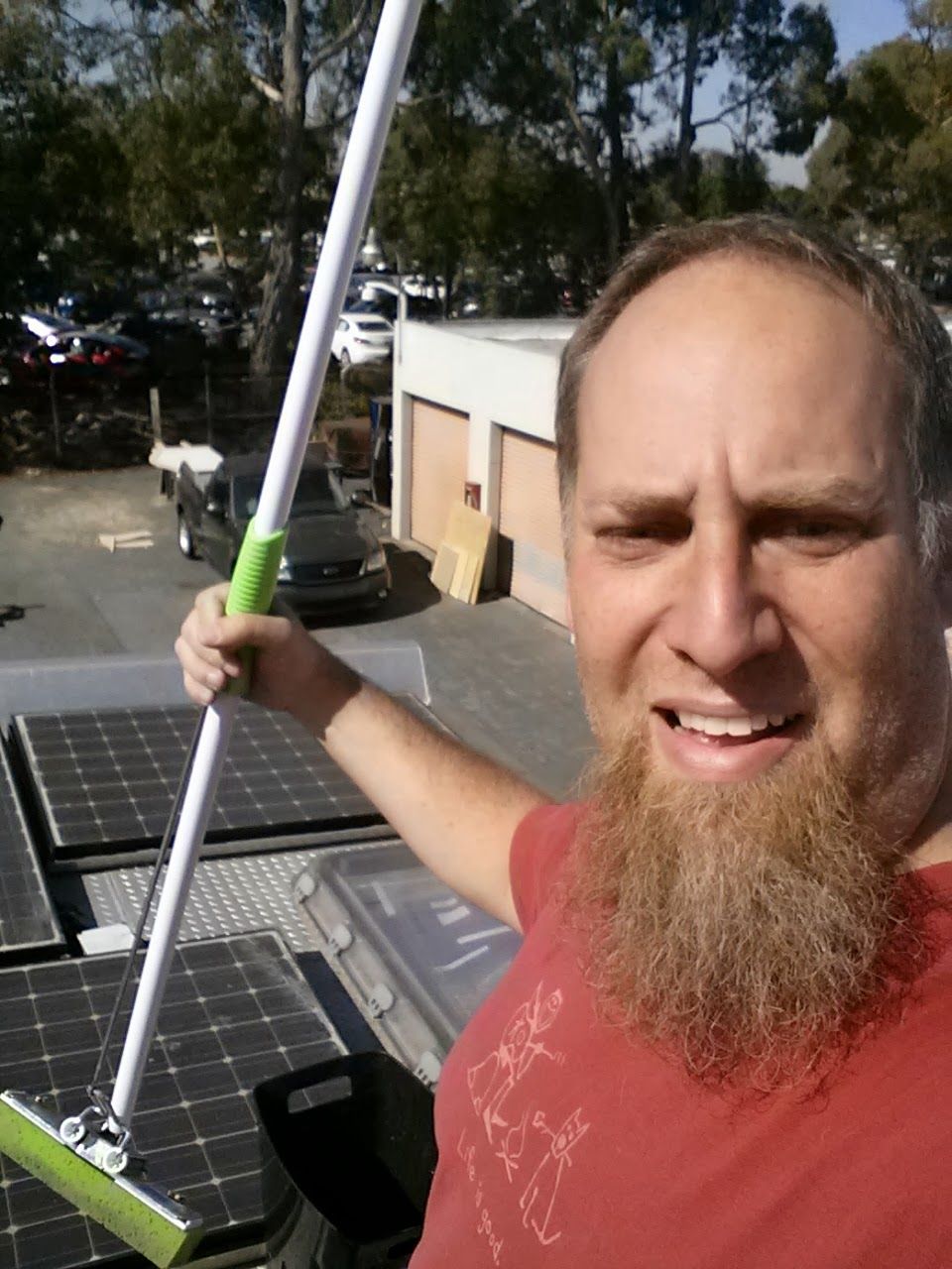 Jay with a mop and solar panels